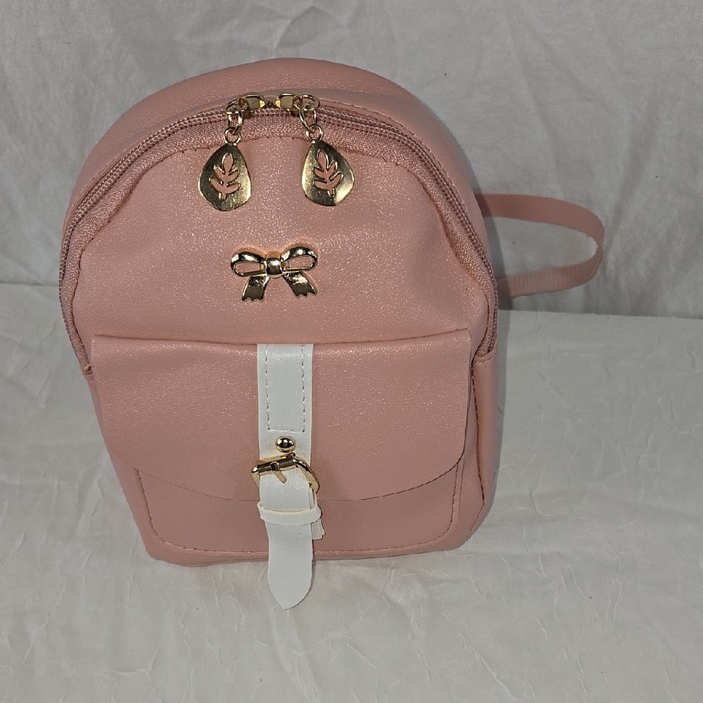Compact Pink and White Backpack with Bow Accents